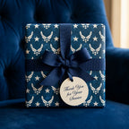 Navy blue Air Force military gift wrap with a navy ribbon and thank you tag by Wrapped Studios.