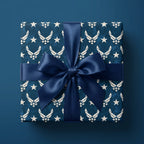 Air Force wrapping paper with a navy blue satin bow on a gift box, by Wrapped Studios.