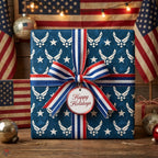 Patriotic Air Force Christmas wrapping paper on a gift with red, white, and blue ribbon by Wrapped Studios.
