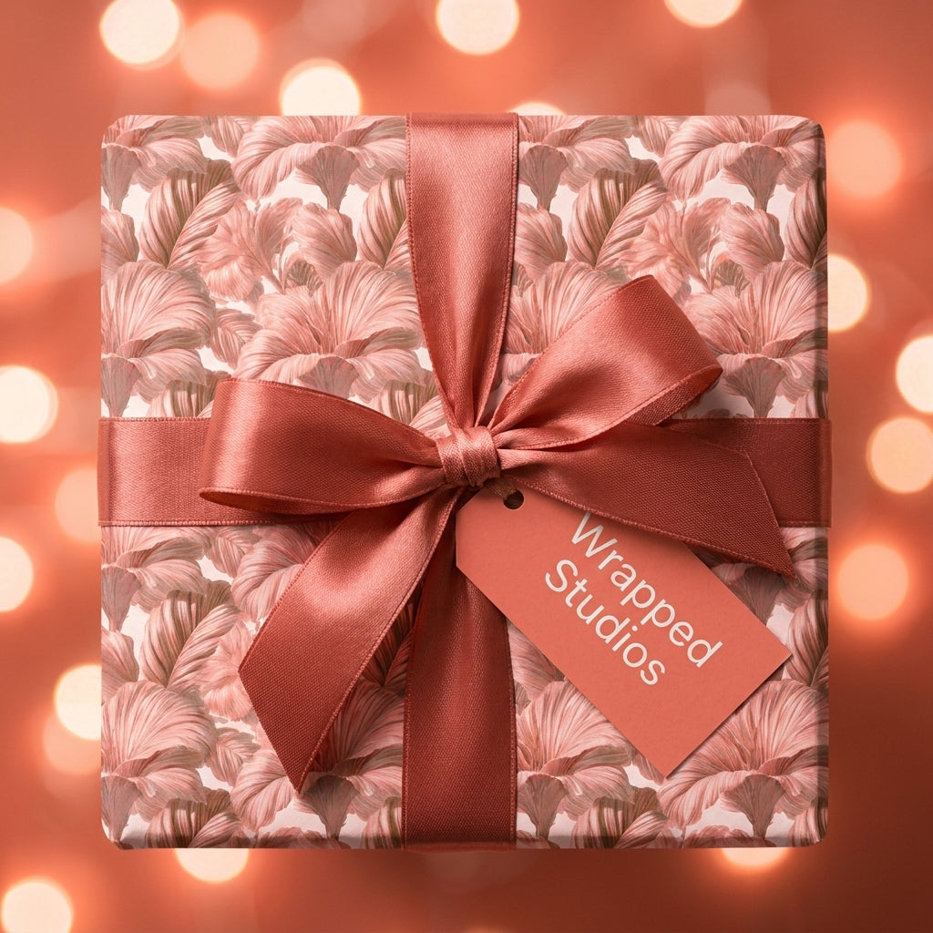 Elegant floral wrapping paper with a dusty rose satin bow, luxury gift wrap by Wrapped Studios.