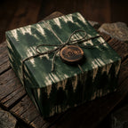 Rustic pine forest Christmas gift wrap with twine and a wooden Noel tag by Wrapped Studios.