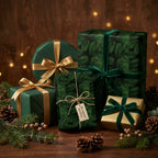 Luxury pine pattern Christmas wrapping paper with velvet ribbons by Wrapped Studios.