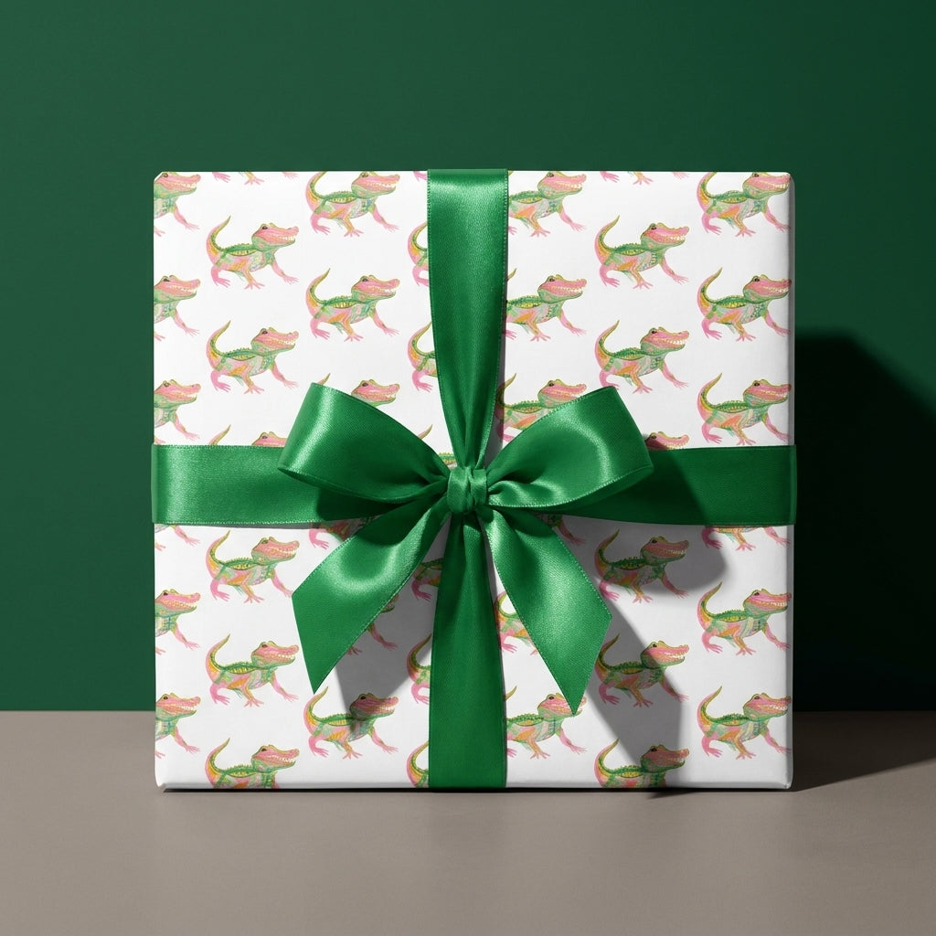 Cute alligator wrapping paper with a green satin bow for kids birthday gifts, by Wrapped Studios.