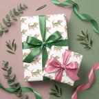 Cute alligator wrapping paper with pink and green satin bows by Wrapped Studios. Great for kids birthday gifts.