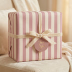 Luxury pink striped wrapping paper with a velvet bow and "For You" gift tag, by Wrapped Studios.