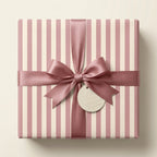 Elegant cream and pink striped birthday wrapping paper with a dusty rose satin bow, by Wrapped Studios.