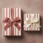 Luxury pink and cream striped wrapping paper with elegant velvet and satin bows by Wrapped Studios.