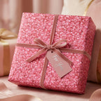 Luxury pink geometric wrapping paper with velvet ribbon for birthday gifts by Wrapped Studios.