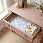 Pink bunny wrapping paper used as a nursery drawer liner by Wrapped Studios.