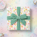 Floral wrapping paper with an sage green velvet ribbon bow, Wrapped Studios.