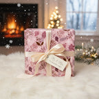 Elegant floral wrapping paper in pink hues with a cream ribbon, perfect for wedding or anniversary gifts.