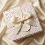 Luxury floral wrapping paper with cream grosgrain ribbon and "Just Because" tag by Wrapped Studios.