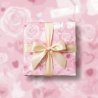 Pink floral wrapping paper with a gold ribbon and bow, perfect for a romantic or birthday gift.