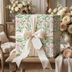 Elegant pink floral wedding wrapping paper with a cream bow and Mr. & Mrs. tag by Wrapped Studios.