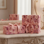 Elegant gifts wrapped in pink floral wrapping paper and ribbon on a vintage vanity.