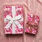 Wrapped gifts with pink ornament Christmas gift wrap and velvet ribbon.