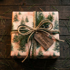 Pine tree Christmas wrapping paper with rustic twine bow and Winter Solstice tag by Wrapped Studios.