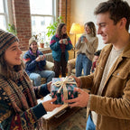 Friends exchanging a gift in pink pine tree Christmas wrapping paper by Wrapped Studios.