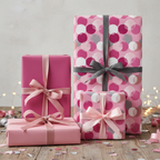 Elegant gifts wrapped in pink circle pattern paper with ribbons, perfect for birthdays.