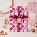 Gift wrapped in pink polka dot wrapping paper with dark pink ribbon bow and "A Special Treat" tag.