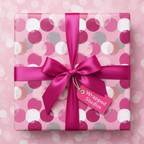 Pink polka dot birthday wrapping paper with bright pink satin bow and gift tag.