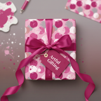 Pink circle patterned gift wrap with matching ribbon and tag for birthdays or special occasions.