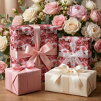 Pink rose floral wrapping paper from Wrapped Studios on elegant wedding and Mother's Day gifts with ribbons.