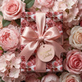 Elegant pink rose floral wrapping paper with a satin bow on a gift box by Wrapped Studios.