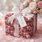 Romantic pink rose floral wrapping paper by Wrapped Studios on a gift box with a sheer white bow.