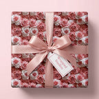 Luxury pink rose floral wrapping paper with a satin bow on a gift box, from Wrapped Studios.