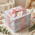 Blue teddy bear baby shower wrapping paper with a pink satin bow, by Wrapped Studios.
