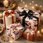 Pink Halloween wrapping paper with cute ghosts and pumpkins by Wrapped Studios, styled with cozy autumn decor.