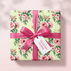 Elegant vintage floral wrapping paper with pink roses and a pink bow by Wrapped Studios.