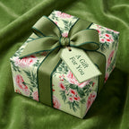 Luxury vintage floral wrapping paper with pink roses and green bow by Wrapped Studios.