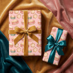 Pink drum Christmas wrapping paper with luxury gold velvet and teal bows by Wrapped Studios.