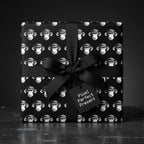 Quirky black and white monkey wrapping paper with a black bow, by Wrapped Studios.