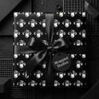 Quirky black monkey wrapping paper with a luxury satin bow by Wrapped Studios, ideal for unique birthday gift wrap.