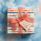Colorful modern gift wrap with stripes, dots, and salmon ribbon from Wrapped Studios.