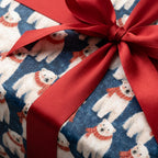Cute polar bear Christmas wrapping paper with a red satin bow. Holiday gift wrap by Wrapped Studios.