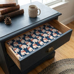Polar bear Christmas wrapping paper used as a drawer liner in a blue nightstand by Wrapped Studios.