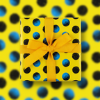 Bright yellow wrapping paper with black & blue dots tied with a yellow ribbon.