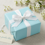 Powder blue gift wrapping paper with white ribbon and bow; perfect for birthdays, baby showers, or elegant gift presentation.