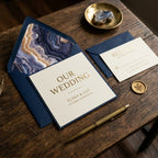 Luxury navy and gold wedding invitation suite with agate envelope liner by Wrapped Studios.