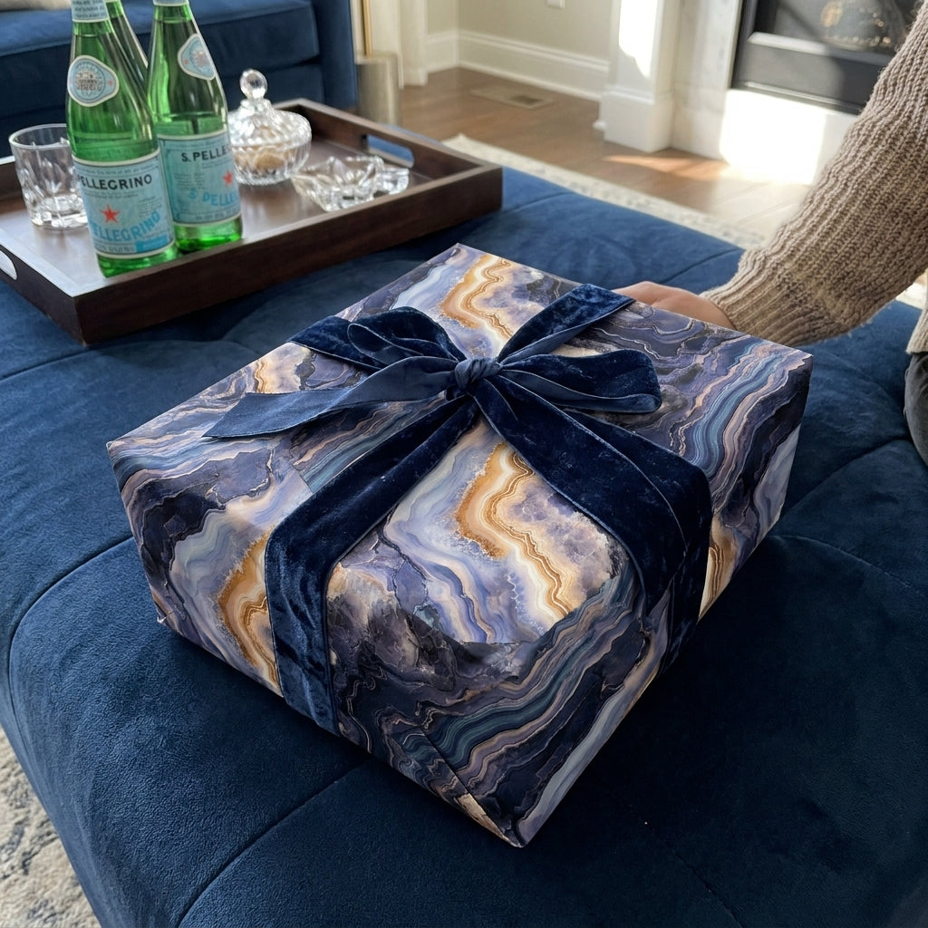 Luxury blue agate wrapping paper with a navy velvet bow by Wrapped Studios.