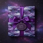 Square gift wrapped in modern purple galaxy wrapping paper with satin ribbon bow against a starry background.