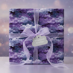 Square gift wrapped in purple galaxy-themed wrapping paper with sheer lavender ribbon.