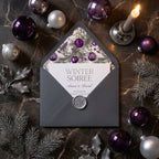 Elegant winter party invitation with purple Christmas ornament liner by Wrapped Studios.