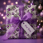 Elegant purple Christmas wrapping paper with ornament pattern and sheer ribbon by Wrapped Studios.