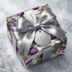 Luxury purple Christmas wrapping paper with a silver satin bow and Noel tag by Wrapped Studios.