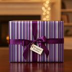 Modern purple and white striped gift wrap with a satin ribbon and tag, perfect for luxury holiday or birthday presents.
